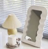 Plastic wave shaped mirror
